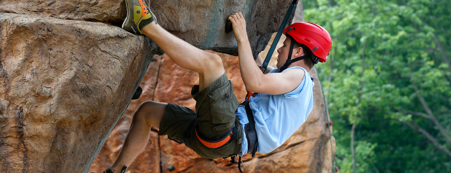 Scout rock climbing